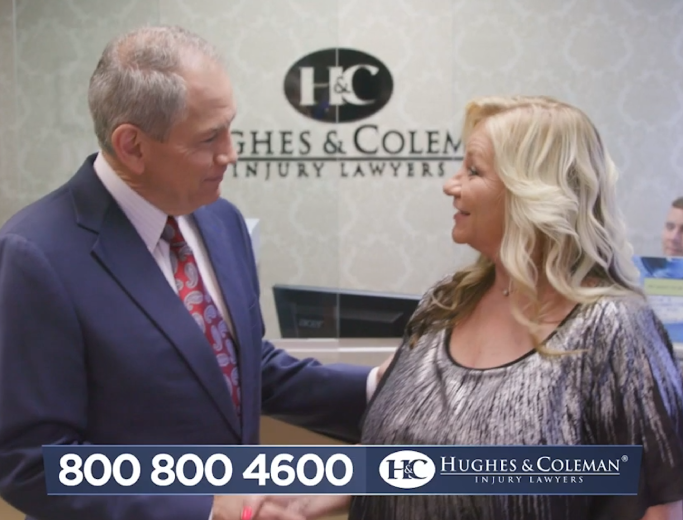 Car accident lawyer Lee Coleman shaking hands with client