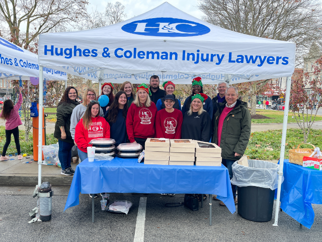 Group of Hughes and Coleman staff at Bowling Green Christmas Parade booth