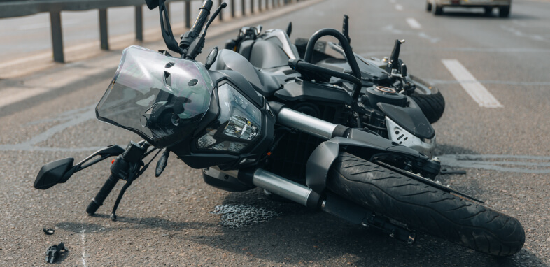Motorycle Motorcycle tipped over after an accident, symbolizing motorcycle accident cases.